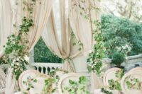 35 a sophisticated neutral wedding harbor done with tan drapes, greenery and white blooms is a very stylish idea for outdoors