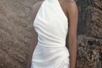 39 a modern hatler turtleneck wedding dress with a draped bodice and skirt plus a thigh high slit is a chic idea