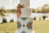 a lovely wedding cake with geo decor