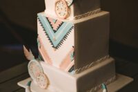41 a bright boho western wedding cake with colorful geo detailing, edible embroidery hoops and feathers and a skull