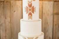 42 a classy western wedding cake with geometric sugar patterns and an edible skull on top is a cool and bold solution to highlight your wedding theme