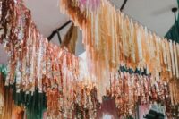 45 colorful and tinsel streamers over your wedding reception space will make it feel festive and super fun