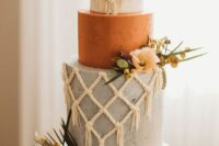47 a white, rust and grey wedding cake with wite sugar macrame, fresh and dried blooms and greenery is amazing for a western wedding