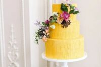 a cute yellow wedding cake