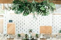 a lovely tropical wedding tablescape
