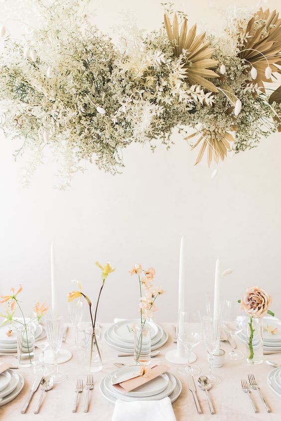 a gorgeous dried leaf, flower and frond wedding installation in a neutral shade will perfectly match a neutral wedding reception