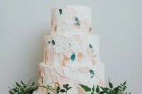 a modern wedding cake with pastel and teal brushstrokes is a fresh idea for a modern wedding and it looks non-boring