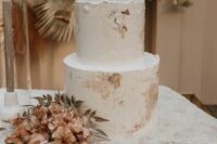 a neutral textural wedding cake with painted brushstrokes is a lovely idea for a modern sophisticated wedding