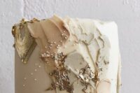 a neutral wedding cake with some gold foil, brushstrokes and polka dots is a lovely idea for a spring or summer wedding