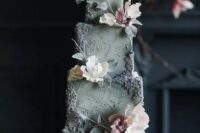 a refined grey textural wedding cake with sugar blooms and leaves is a very sophisticated idea to rock