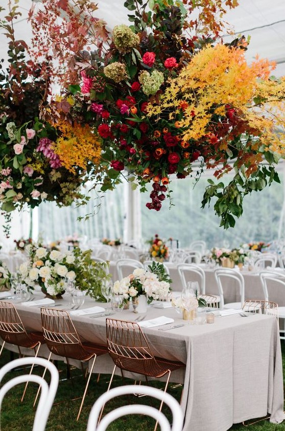 a super lush and super bright floral installation over the reception tables will make a gorgeous statement