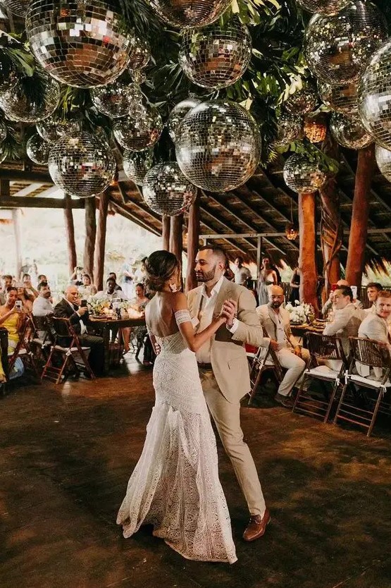 lovely wedding venue decor decorated with clusters of disco balls