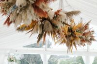 colorful dried grass wedding installations of pampas grass spray painted will add interest and chic to the reception