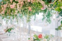 a lovely wedding table with tall centrepieces