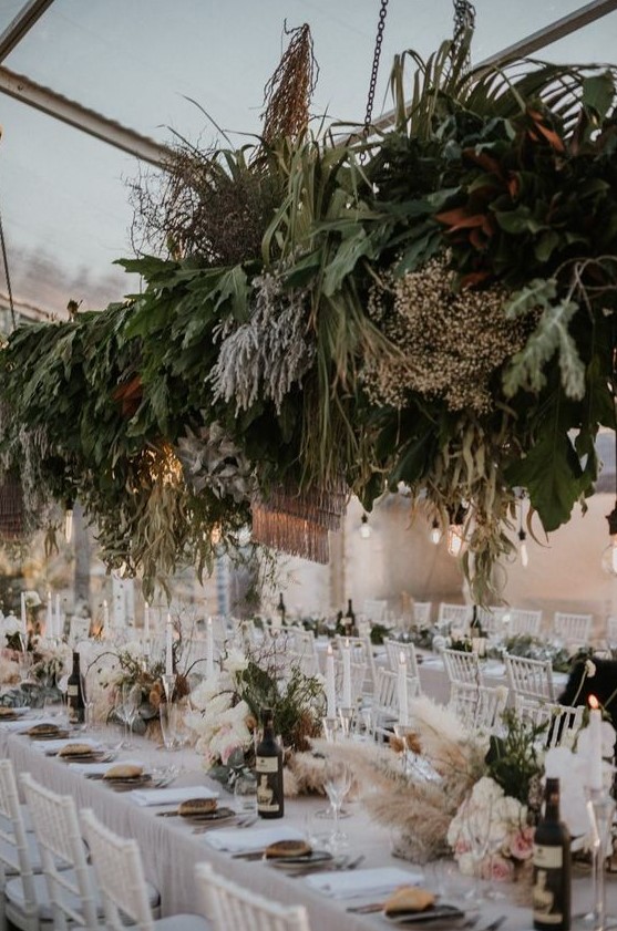 this reception was floral forward with lush greenery, pampas grass and foliage of various shades
