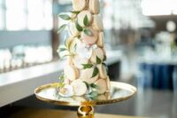 02 a blush macaron tower with greenery is a cool and pretty idea for a spring or summer wedding, it looks chic and elegant