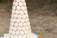 04 a large white macaron tower is a cool alternative to a usual wedding cake, it looks very elegant