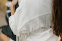 04 a white denim bridal jacket with crystal fringe is a very beautiful and glam wedding solution