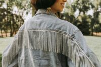 a blue oversized denim jacket with crystal fringe is a cool idea for a boho bride who loves a bit of glam