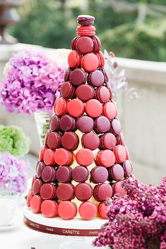 a super bold macaron tower with an ombre effect is a cool idea for a jewel tone wedding, it looks amazing