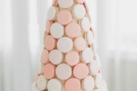 10 a refined wedding cake – a blush cake and a blush and peachy macaron tower on top is amazing for a refined wedding