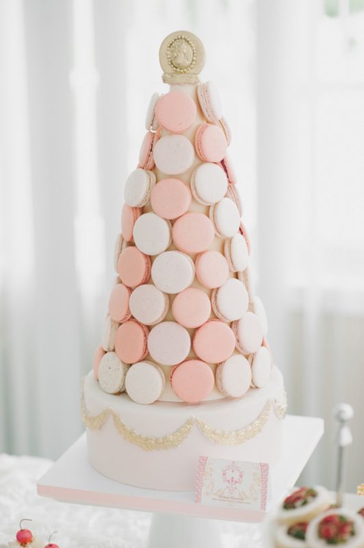 a refined wedding cake - a blush cake and a blush and peachy macaron tower on top is amazing for a refined wedding