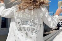 10 a white denim jacket with fringe, silver embroidered letters and stars is a cool idea for a celestial bride