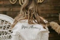 11 a white jacket with black calligraphy and macrame and long fringe is a gorgeous idea for a boho bride