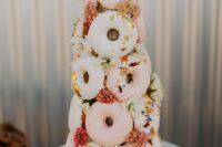 14 a beautiful and cool pink and white glazed donut tower with fresh blooms and gold foil is a sophisticated and chic idea for a wedding