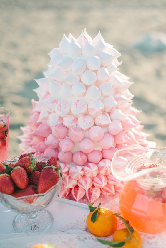 a pretty and delicious-looking ombre pink meringue wedding cake is a gorgeous idea for a pink wedding