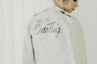 19 a white leather jacket with black calligraphy, stars and a wedding date is a cool idea and this paint can be removed if you wanna wear it afterwards