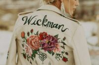 20 a white leather jacket with hand painted blooms and a new second name is a chic and bold cover up idea for a bride