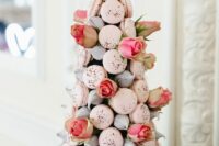 22 a fresh and modern take on a classic croquembouche wedding cake – a tower of meringues and pink macarons decorated with pink roses
