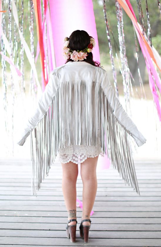 a white leather bridal jacket with super long fringe on the back and sleeves is amazing for a modern boho bride