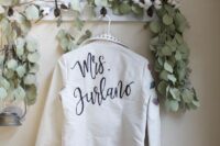 22 a white leather jacket with studs and painted blooms is a chic cover up for a spring or fall wedding, can be worn to a winter one, too