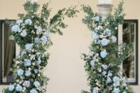 23 a lovely hydrangea wedding alatr created in a real wedding arch, with greenery and light blue hydrangeas is a delicate and chic idea