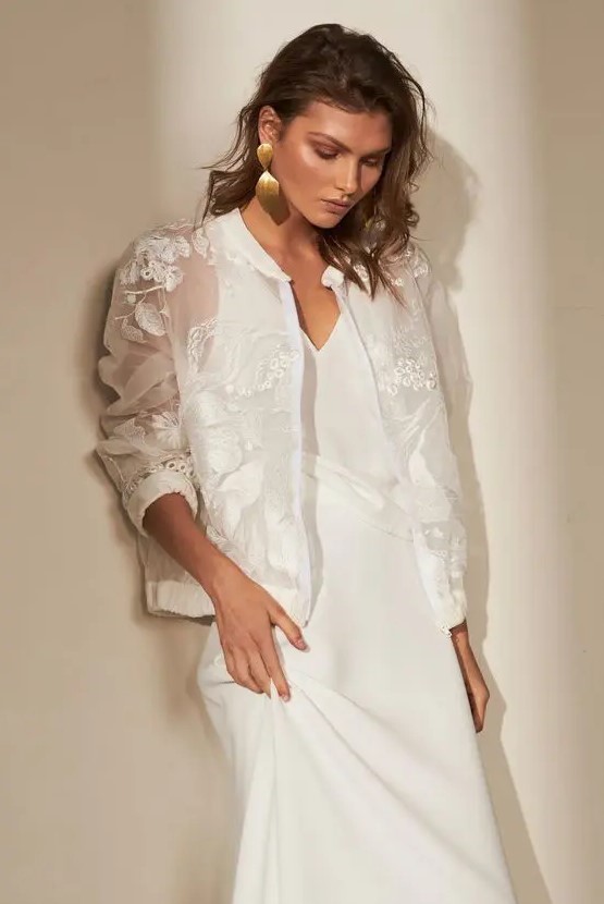 a beautiful oversized sheer bridal jacket with lace applique and embroidery is a stunning cover up for a fall or winter bride