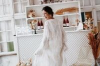 27 a jaw-dropping maxi fringe cover up with long sleeves is a lovely idea for a boho bride, it’s a fantastic solution to try