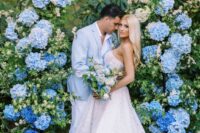 27 an ombre wedding arch composed of greenery and bold blue, light blue and white hydrangeas is a gorgeous idea for a blue wedding