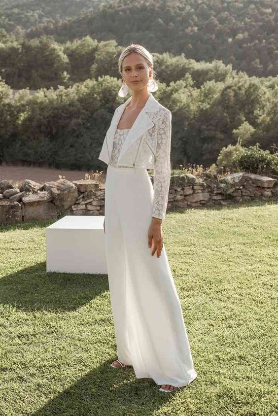 a modern bridal look with plain wideleg pants, a lace top and a matching moto jacket is a cool idea