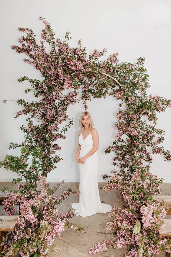 such a lush monochromatic blooming wedding arch will make a statement at a modern or minimalist spring wedding