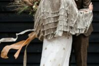 29 a unique grey fringe bridal jacket is a beautiful detail for your bridal look, it will bring a strong boho feel to the outfit