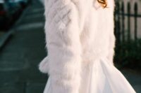 39 a white faux fur bridal jacket is a timeless solution for a winter bride, such a piece will match many looks