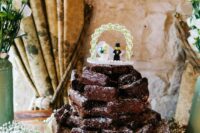 a brownie stack topped with a fun Lego topper surrounded with white baby’s breath is a cool solution for a casual wedding
