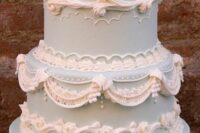 a chic blue and white lambeth wedding cake with sugar detailing is a lovely idea for a spring wedding with a trendy feel