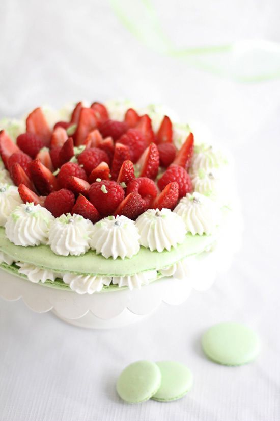 a gorgeous mint macaron wedding cake with vanilla, with fresh strawberries on top is amazing for spring or summer weddings