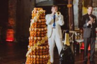 a lemon croquembouche topped with sugar icing and caramel and lemon slices is a lovely idea