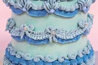 a mint, pale blue and blue lambeth wedding cake decorated with blue and gold beads is a cool idea for a bold wedding