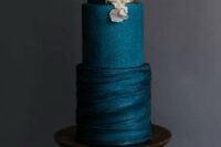 a sophisticated teal wedding cake with textural tiers, gold leaf and blush blooms is a very chic and very stylish idea for a modern wedding