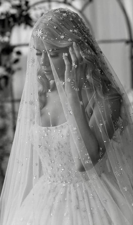 a star embellished veil that matches the star embellished wedding ballgown for a glam and bold celestial bride